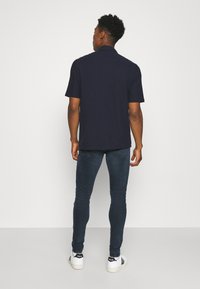 Levi's® SKINNY TAPER - Calças de ganga de corte skinny - ocean pewter