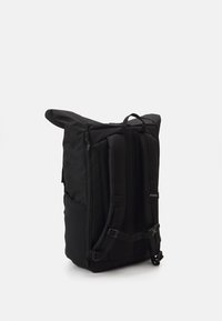 Black backpack with a roll-top design, equipped with padded adjustable straps, side pockets, and a durable fabric texture.