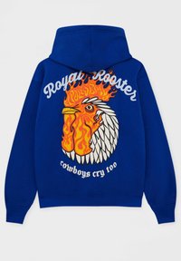 Blå huva med en färgglad tuppdesign med lågor, texten "Royal Rooster" och "cowboys gråter också" i vitt.