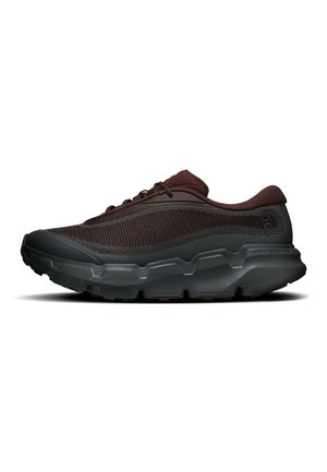 Dark brown and black athletic shoe with thick textured sole, lace-up design, and mesh fabric upper for breathability.