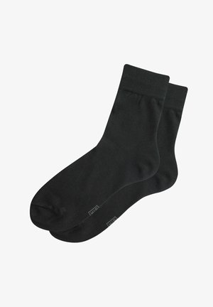 Schwarze Baumwollsocken mit einer glatten Textur, Design bis zur Mitte der Wade und verstärkter Zehenpartie. Mit einem dezenten Logo an der Seite. Geeignet für Freizeitbekleidung.
