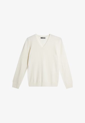 V-pääntie, pitkähihainen neule pehmeässä kermanvärisessä kankaassa. Ominaisuuksina ribbaus hihansuissa ja helmassa sekä hienovarainen logo rinnassa.