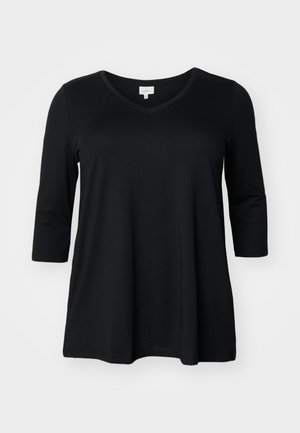 Czarna, długosleeve koszulka z dekoltem w kształcie litery V, wykonana z miękkiego materiału, charakteryzująca się luźnym krojem i okrągłym dołem. Gładka tekstura bez widocznych wzorów czy akcentów.