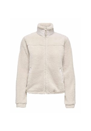 Veste polaire blanche zippée intégralement, col montant, manches longues et poches latérales, en tissu doux et texturé.