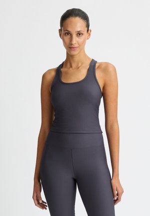 Gray ribbed sports tank top with wide straps and a scoop neckline, paired with matching high-waisted leggings. Smooth texture throughout.