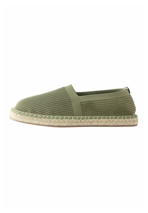 Light green slip-on espadrille with mesh upper, elastic side panel, braided jute midsole, and flat rubber outsole.