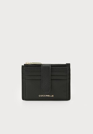 Black leather wallet featuring a textured finish, multiple card slots, a central zip compartment, and a gold-tone logo.