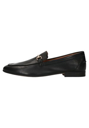 Black leather loafers with a flat sole, rounded toe, decorative strap, and small metal hardware detail on the front. Smooth texture.
