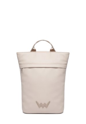 Beige leather backpack with a structured shape, featuring a top handle, zipper closure, and a decorative logo at the front bottom.