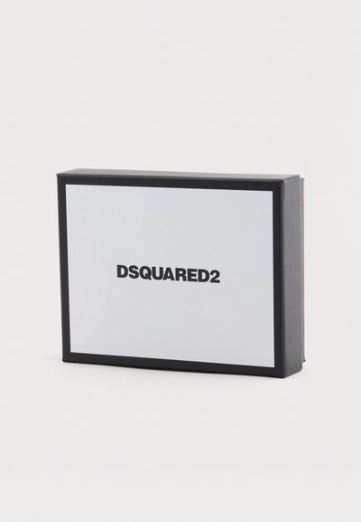 Boîte rectangulaire DSQUARED2 en noir et blanc avec une bordure noire sur un fond blanc uni.