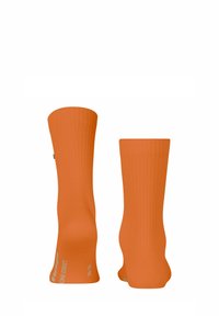 Helle orange Sport-Socken mit gerippter Textur. Verfügt über verstärkte Ferse und Spitze mit Branding am Knöchel.