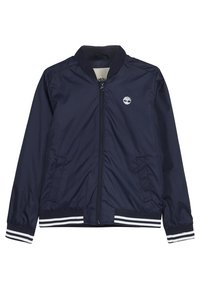 Giacca bomber blu navy realizzata in materiale leggero. Presenta una chiusura frontale con zip, due tasche laterali e accenti a strisce bianche sui polsini e sull'orlo.