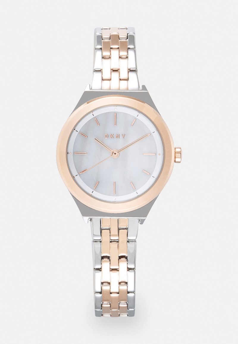 Silver and rose gold wristwatch with a round, mother-of-pearl dial. Features minimalist markers and a linked bracelet design. Brand: DKNY.