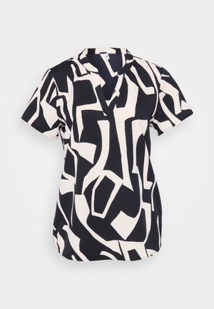 Kortærmet bluse i marineblå og creme med et abstrakt geometrisk mønster, der har en notch-udskæring og en afslappet pasform. Tekstureret stof.