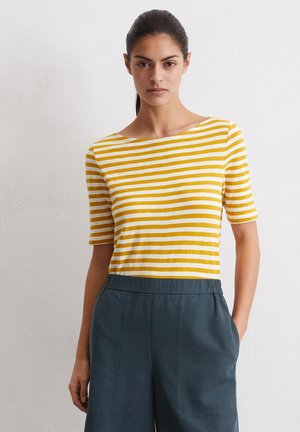 Yellow and white striped short-sleeve top with a wide boat neckline, paired with dark green shorts. Cotton material with a soft texture.