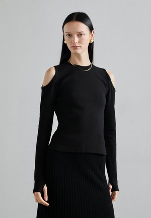 Zwarte geribde langemouwen top met cold-shoulder uitsparingen, met een aansluitend ontwerp en een gladde textuur. Draagt samen met een bijpassende geribde rok.