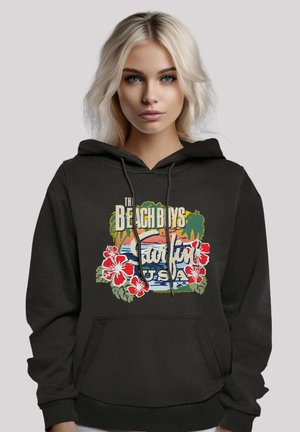 Black hoodie featuring a front graphic with "The Beach Boys Surfing USA," surrounded by tropical elements and red hibiscus flowers.