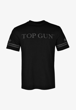 Sort bomulds-T-shirt med "TOP GUN" i store grå bogstaver over brystet og grå striber med stjerner på ærmerne.