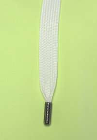 Light green fabric with a white textured cord and a silver aglet at the end, featuring embossed text on the aglet.
