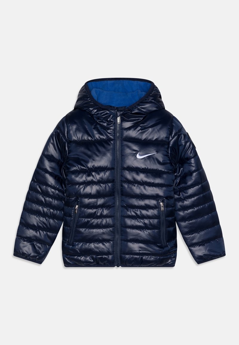 Navy puffer jacket with a glossy finish, hood, front zipper, and two side pockets. Inside features a blue fleece lining. Nike logo on chest.