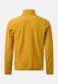 Veste polaire jaune moutarde vue de dos avec manches longues et col montant sur un fond uni.