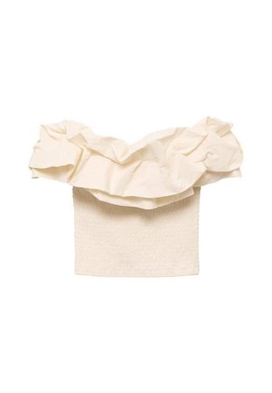 Haut couleur crème avec une partie inférieure texturée et froncée, et un design à volants au niveau du col. Fait en tissu léger.