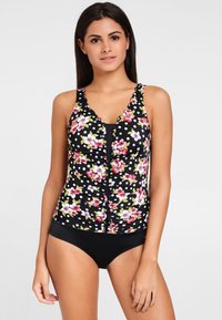 Haut de maillot de bain noir à motifs floraux, avec des motifs floraux roses et blancs accompagnés de pois, des bretelles volantes et une fermeture à boutons sur le devant.