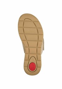 Semelle de chaussure en caoutchouc beige avec surface texturée, design contourné et accent circulaire rouge. Taille 37 imprimée sur le côté.