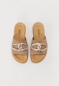 Tan suede slip-on sandals with a metallic chain accent, padded footbed, and patterned cork outsole. Size 37.
