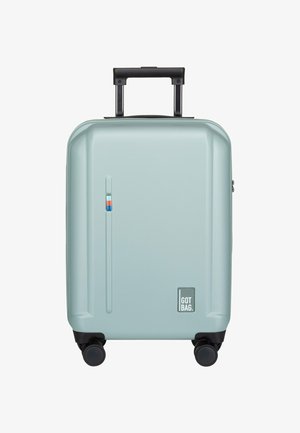 Maleta de mano rígida en un suave verde menta, con un mango retráctil, cuatro ruedas negras y un pequeño logo en el lateral.