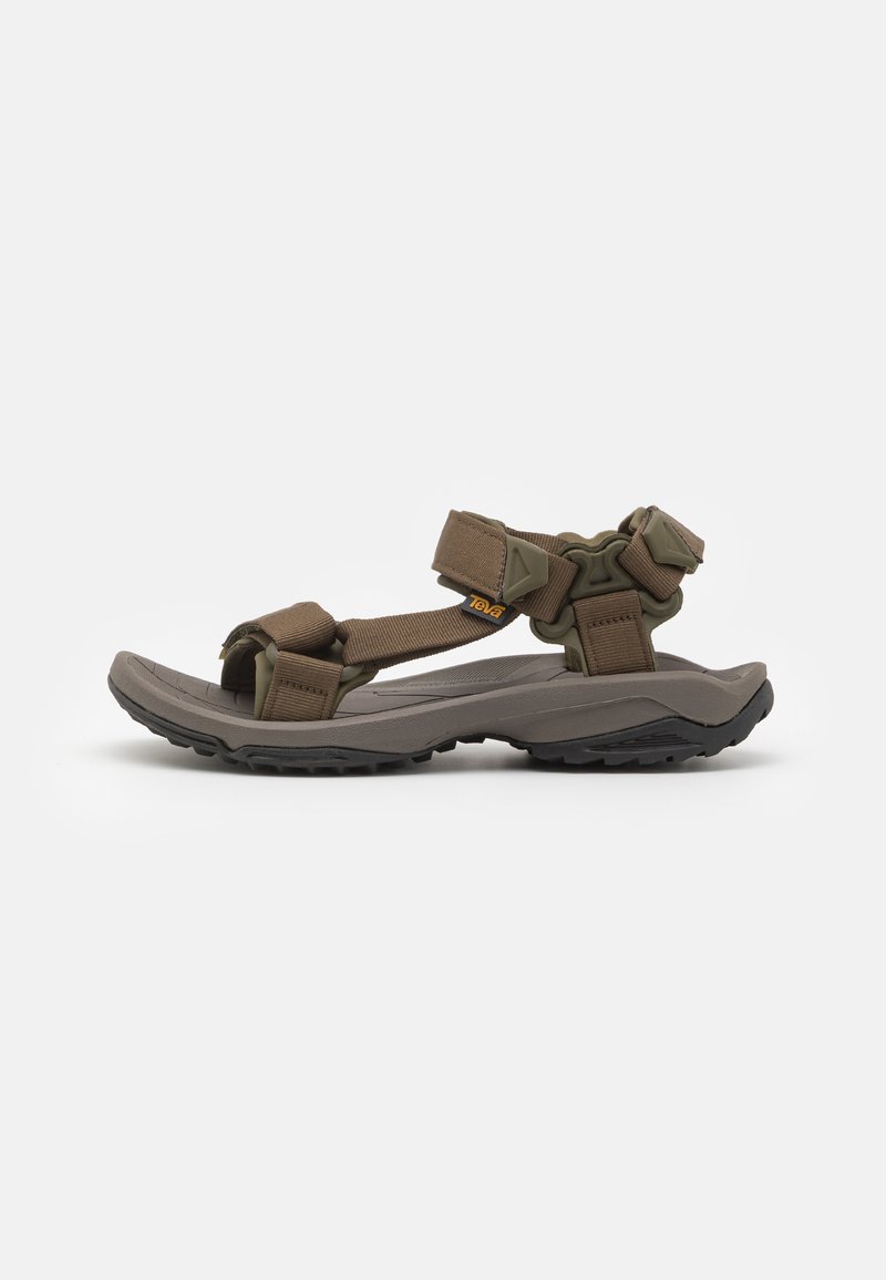 Brown fabric strap sandals with a lightweight gray sole, featuring adjustable straps and textured black outsole for traction.