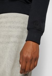 Calvin Klein Jeans CORE MONOGRAM - Sweatshirt - black