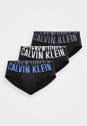 Three pairs of black briefs with varying waistband designs. One features a solid black band, another has a white band, and the last one has a blue accent.