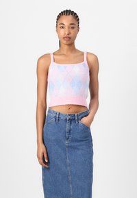 Knitted crop top featuring a pink and blue argyle pattern, square neckline, and thin straps, paired with a high-waisted denim skirt.