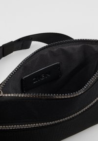 Zign Bältesväska - black