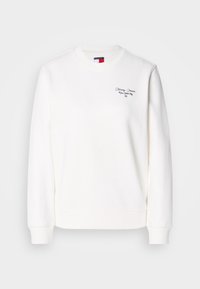 Sweat-shirt blanc à manches longues et col rond avec petit texte « Tommy Jeans New York City » et logo sur la partie supérieure gauche de la poitrine.