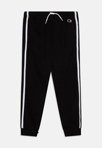 Mustad mustad püksid valgete küljeribadega, elastse vöökoha ja nööriga. Valmistatud pehmest puuvillasegusest kangast. Põlvedel on mansetid.