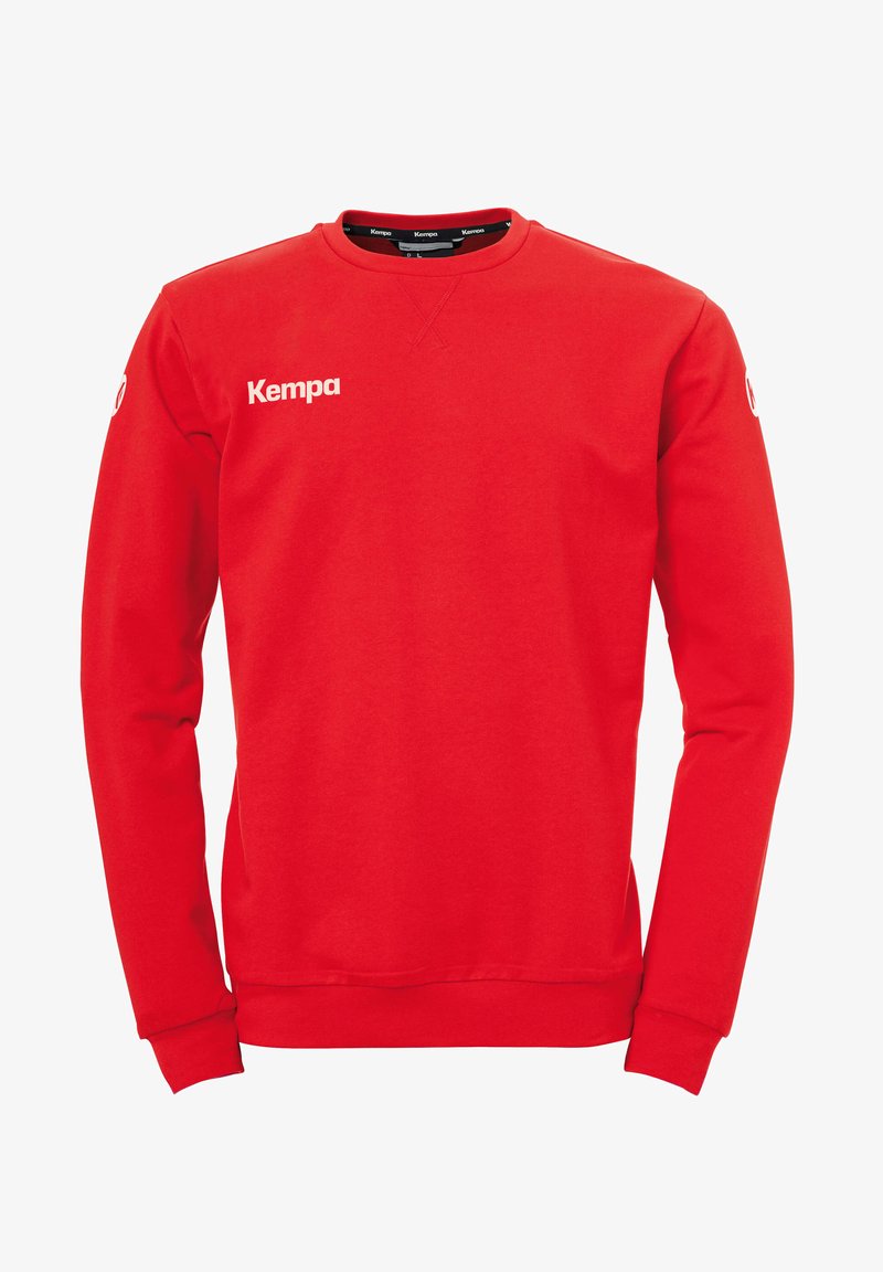 Red sweatshirt made of cotton with a round neckline, long sleeves, and ribbed cuffs. Features "Kempa" logo in white on the front.