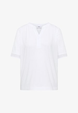 Biała bluzka z krótkim rękawem, dekoltem w serek i koronką z oczkami na krawędziach rękawów, wykonana z miękkiego materiału, oznaczona "CECIL".