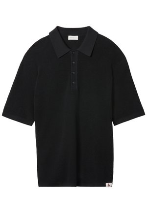 Černé pletené polo s krátkými rukávy se čtyřmi knoflíky, žebrovaným límcem a manžetami a malou štítkovou značkou Calvin Klein na lemu.