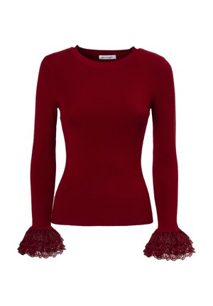 Roter gerippter Langarmpullover mit Spitzenlatzhülsen, die über kreisförmige Muster verfügen. Rundhalsausschnitt und taillierte Silhouette.
