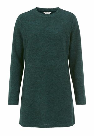 Teal pitkähihaisen tunika, joka on valmistettu teksturoidusta kankaasta. Siinä on pyöreä pääntie ja suora leikkaus. Helma on takaa hieman pidempi.