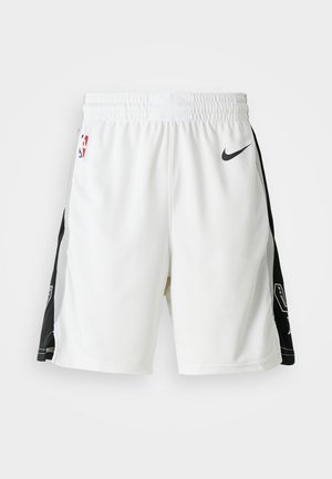 White basketball shorts with a black side panel, mesh texture, elastic waistband, and Nike logo. Features NBA emblem on front.