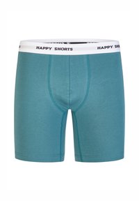 Turquoise boxershorts van zacht materiaal, met een contrasterende witte elastische tailleband waarop "HAPPY SHORTS" in het zwart is gedrukt.