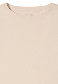 Beige short-sleeve t-shirt made of soft cotton. Features a round neckline and a plain design without patterns or embellishments.