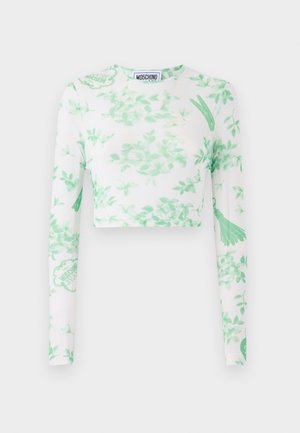 Hvit langermet crop topp med grønt blomstermønster, logo-detaljer og mykt, elastisk stoff. Rund halslinning og slim fit-design.