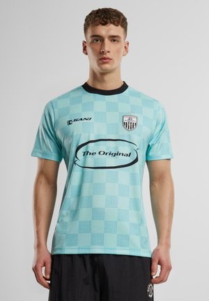 Light turquoise sports jersey with a checkered pattern, black collar, and logo. Features bold text "The Original" on the front.