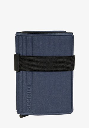Portafoglio compatto blu navy con fascia elastica nera e marchio "SECRID" in rilievo sulla copertina anteriore.