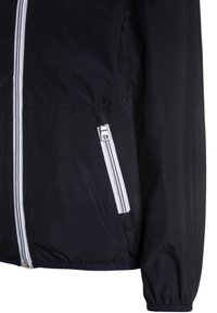 Chaqueta de marina con un tejido suave y ligero, cremallera frontal completa y acentos blancos en los bolsillos, con puños y dobladillo elásticos.