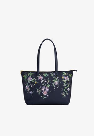 Mornarska torba z dolgimi ročaji in zadrgo, okrašena z natančnimi rožnatimi in zelenimi cvetličnimi in listnatimi vzorci.